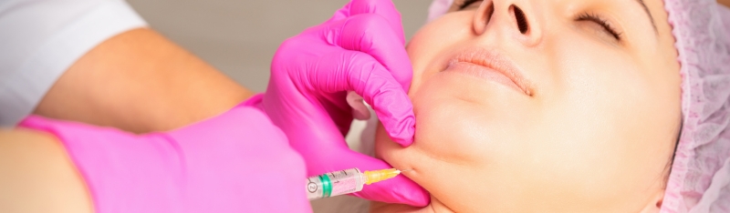 Person receiving non surgical double chin fat reduction treatment to slim under-chin area and improve jawline definition